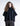 Poncho estructurado de manga butterfly con cuello alto y bolsillos laterales tipo side seam.