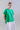 Front view of drawstring side-gathered mercerized cotton T-shirt with relaxed fit, rounded hem, and adjustable side drape.