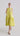 Flash Lemon sleeveless peplum dress shown from the front, featuring round neckline and structured peplum hem.
